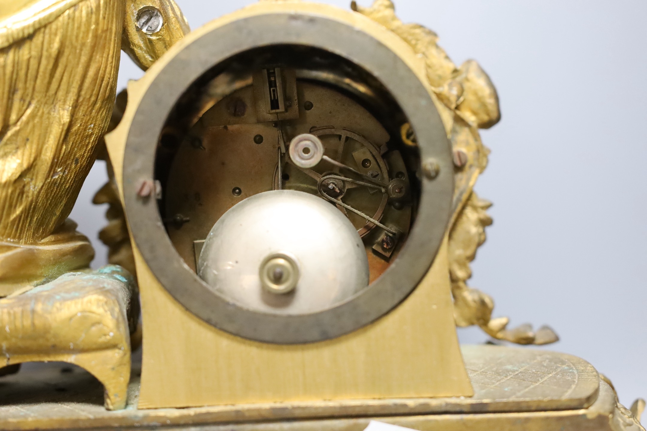 A French gilt metal mantel clock with blue enamel floral decoration and mounted lady reading - 47cm long
